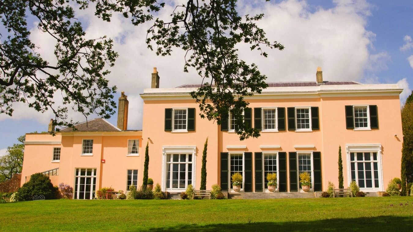 Exterior of Bignor Park viewed from the South lawn, luxury private estate for weddings in Sussex South Lawn