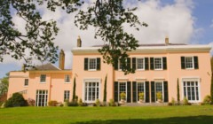 Bignor Park wedding venue Georgian house West Sussex with elegant symmetry, black shutters and expansive South lawn for outdoor celebrations