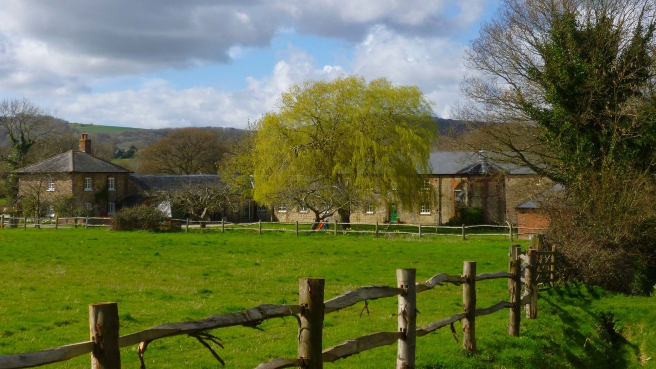 Bignor Park Estate buildings with the South Downs in the background