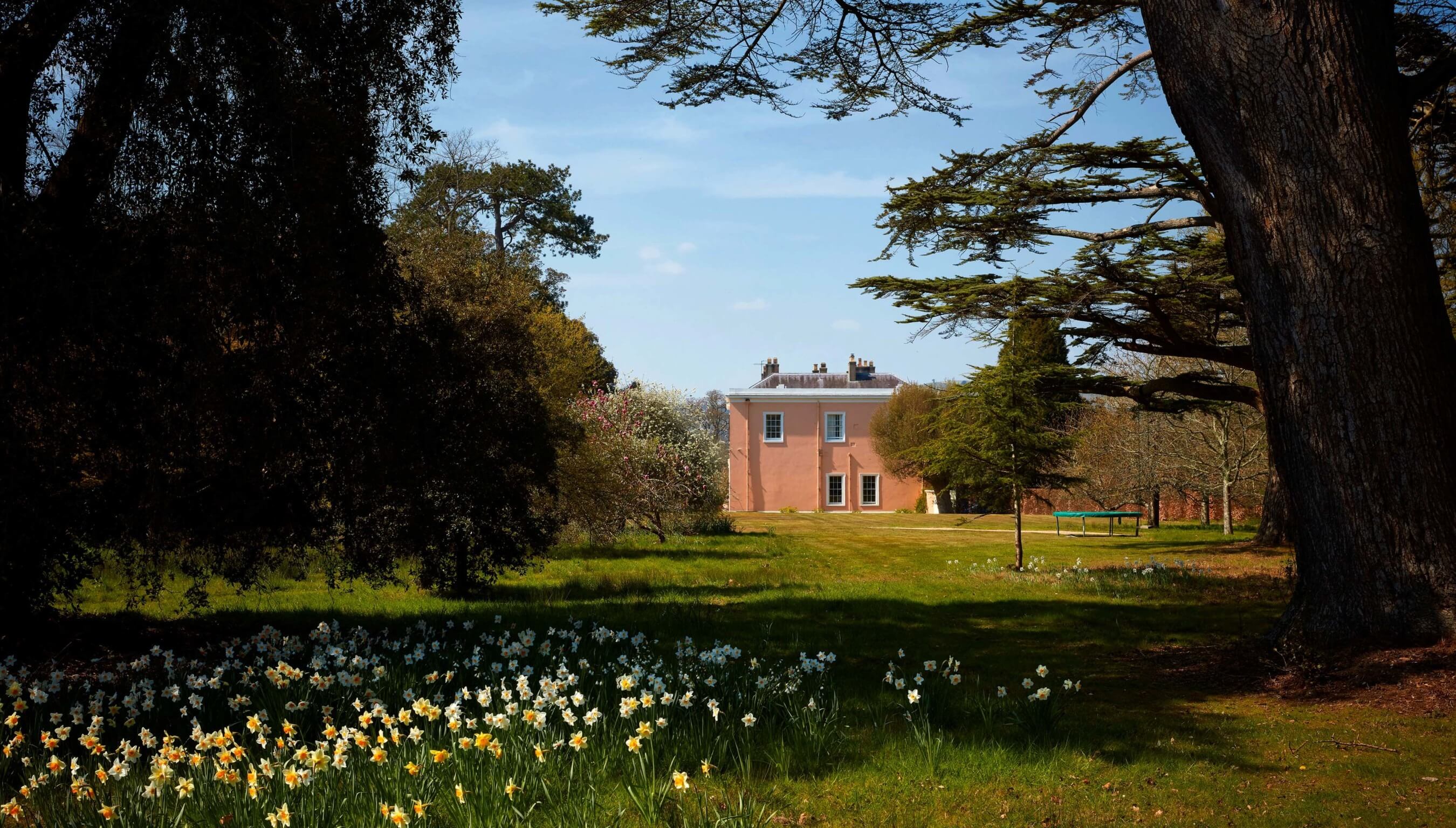 Outdoor wedding venue Bignor Park, a view of the main house and Crocket Lawn